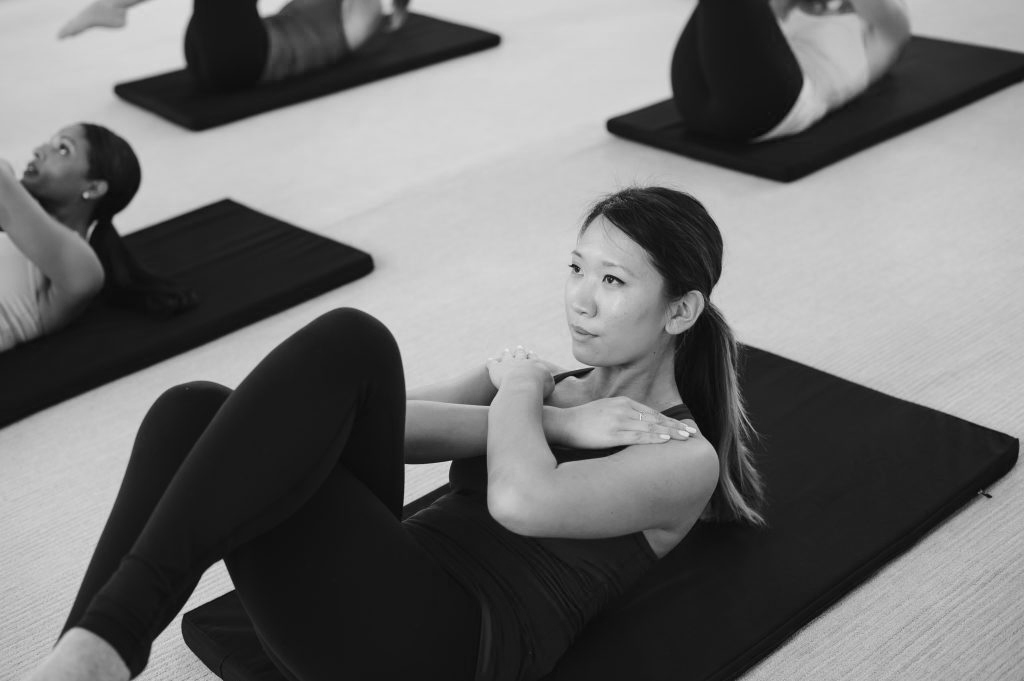 A woman is practicing abdominal work.