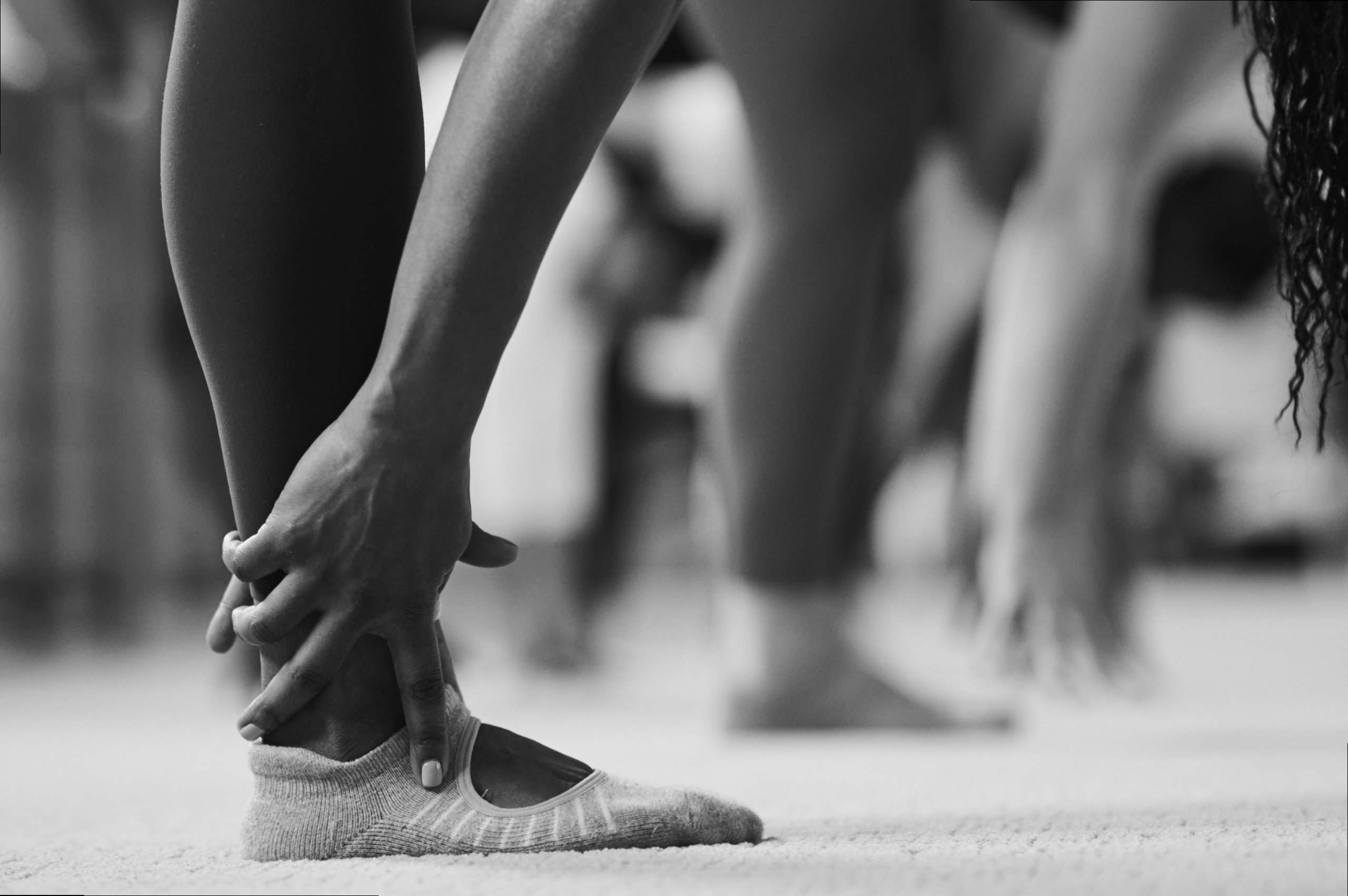 Black and white image of two feet on its toes